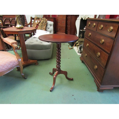 4228 - A mahogany circular tilt-top wine table on a bobbin-turned column and tripod base, 70cm tall x 49cm ... 