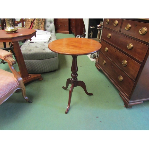 4233 - A mahogany circular tilt-top wine table on baluster turned column and tripod base, 68.5cm tall x 49c... 