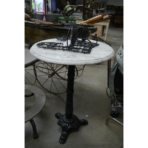 2044 - A cast iron based wine table with marble top