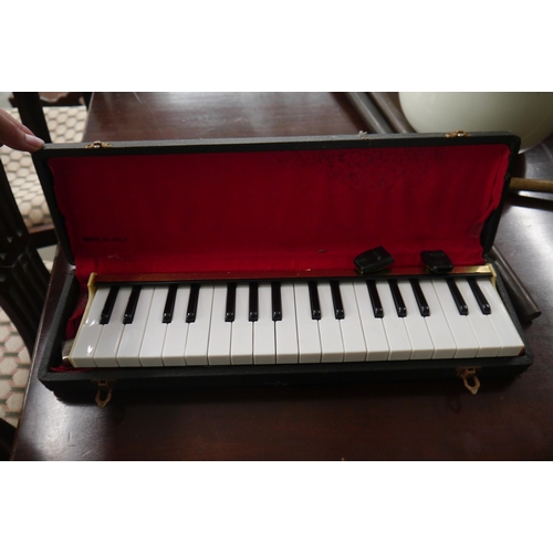 2126 - A cased Clavietta melodica