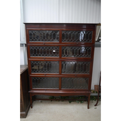 2156 - An Edwardian mahogany lead glazed four section stacking bookcase, one cracked pane