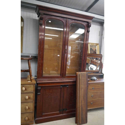 2163 - A Victorian mahogany bookcase, glazed upper section above two cupboards