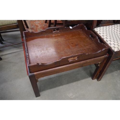 2200 - A Georgian style mahogany tray top coffee table on stand