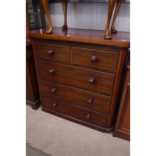 2235 - A Victorian mahogany round-cornered chest of two short over three long drawers, plinth base, bun han... 