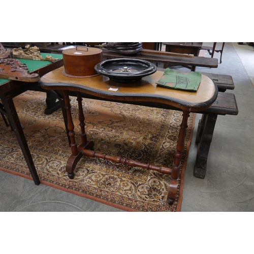 2245 - A Victorian walnut table with floral design