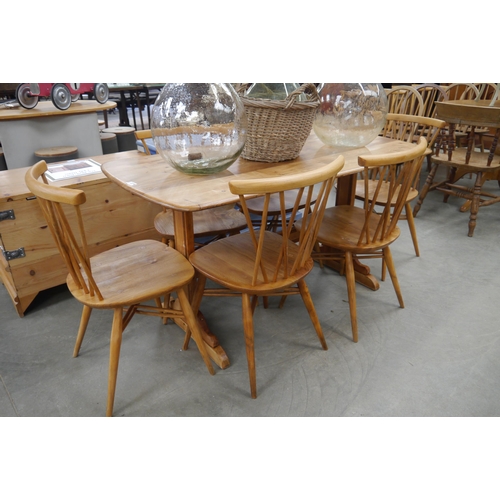 2274 - A stripped Ercol dining table and six Ercol candle stick chairs  (R) £300