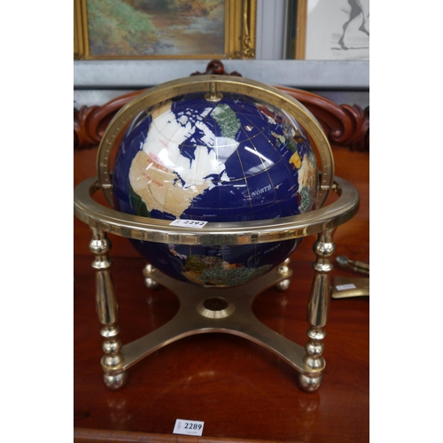 2292 - A table top world globe with specimen stone