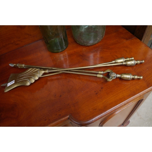 2293 - A set of brass fire irons