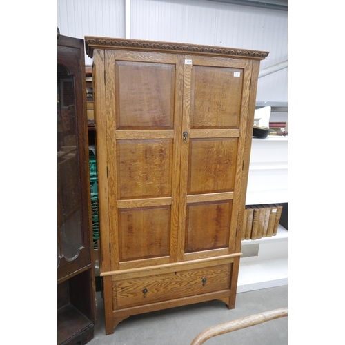 2329 - An oak two door wardrobe with drawer and bedroom chair (2)