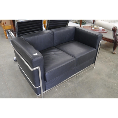 2345 - A black vinyl and chrome two seater sofa