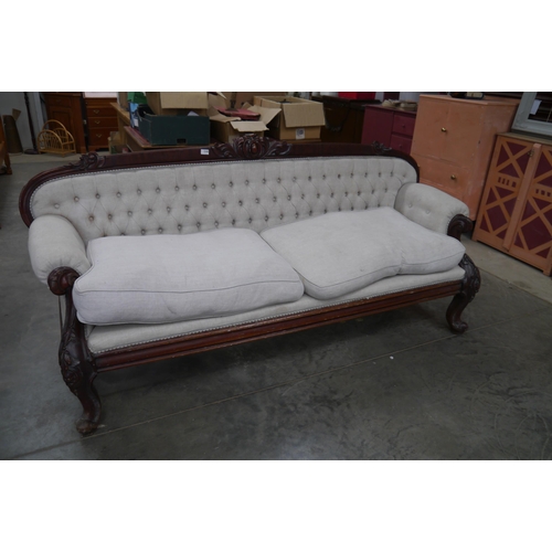 2349 - A Victorian scroll top button back sofa re-upholstered, 210cm long