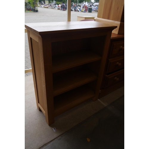 2450 - A light oak shelving unit