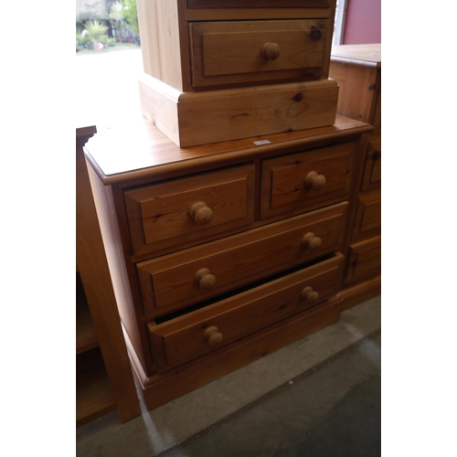 2452 - A pine two over three chest of drawers