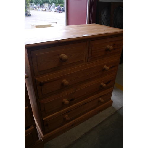 2453 - A pine two over three chest of drawers