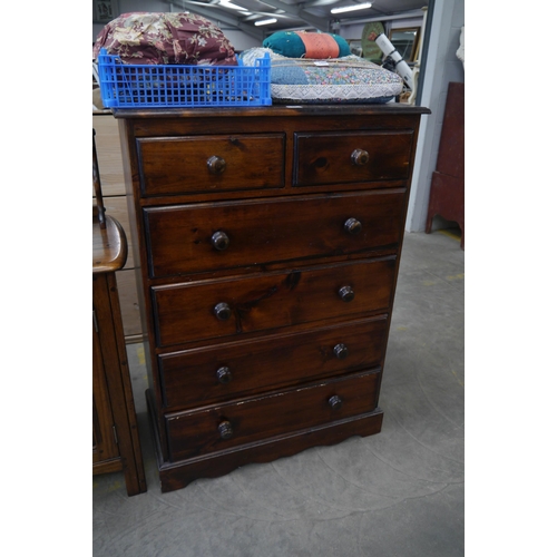 2459 - A stained pine two over four chest of drawers