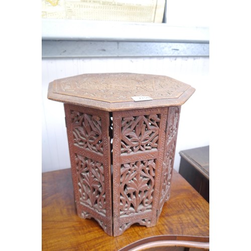 2150 - A wood ornate carved hinged Indian occasional table