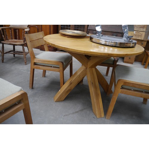 2286 - An X framed circular oak dining table