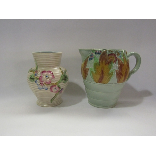 4288 - A floral Clarice Cliff vase together with a Clarice Cliff jug 18cm tall