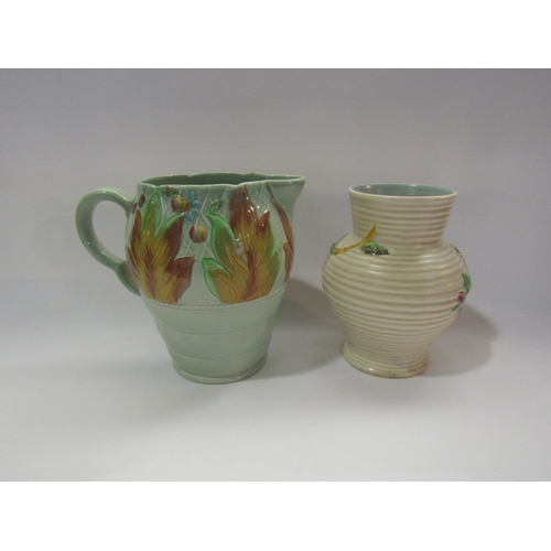 4288 - A floral Clarice Cliff vase together with a Clarice Cliff jug 18cm tall