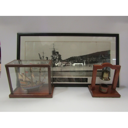 4300 - A framed photograph of HMS Duke of York with cap tally, 23cm x 55cm, with cap tally, together with a... 