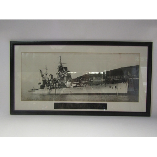 4300 - A framed photograph of HMS Duke of York with cap tally, 23cm x 55cm, with cap tally, together with a... 