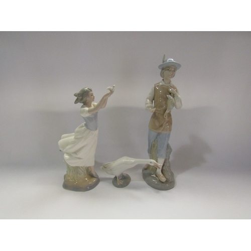 4301 - Three ceramic figures including Lladro goose, Miquel Requena lady holding a duck and a Valencia figu... 