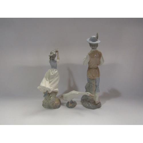 4301 - Three ceramic figures including Lladro goose, Miquel Requena lady holding a duck and a Valencia figu... 