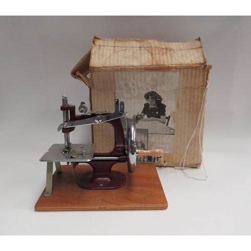 4432 - A Junior manual miniature sewing machine, boxed