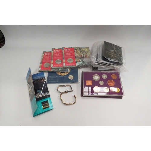 4458 - A box containing anniversary coins including three Royal Mint fire of London £2 coins and Coinage of... 