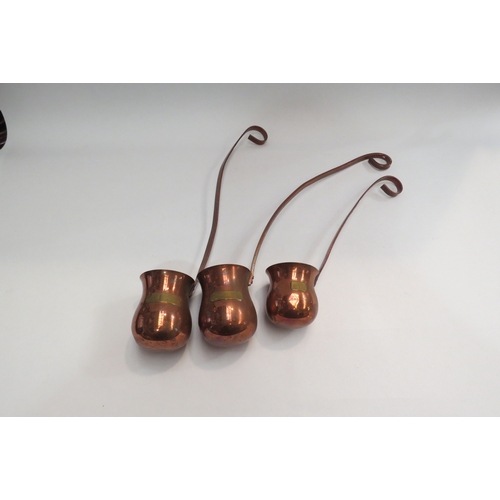 4466 - Three copper and brass spirit measures, whisky, vodka and gin  (E)  £15-20