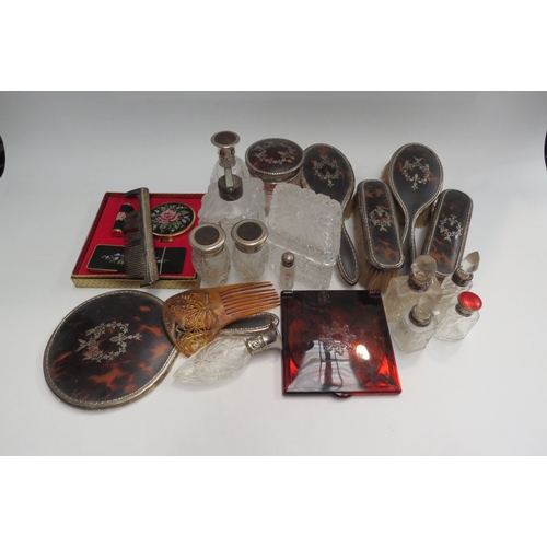 4469 - Dressing table items including scent bottles, brushes and mirrors. Silver and tortoiseshell examples... 