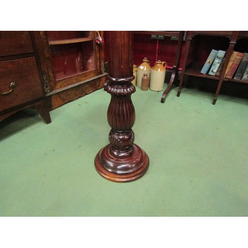 4136 - A hardwood jardiniere stand, fluted detail, 102cm tall