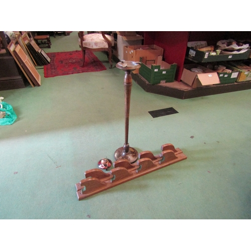 4169 - A hand-painted Oriental floor-standing ashtray with a table lighter and a gun rack (3)