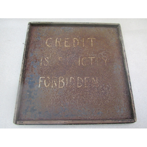 8202 - A hand written 'Credit is strictly forbidden' tin garage sign. 44cm x 43cm