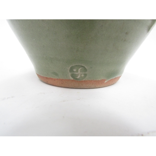 7093 - A St Ives standard ware pottery jug with green glaze, impressed Pottery seal only. 19cm high