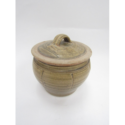 7144 - RICHARD BATTERHAM (1936-2021) A studio pottery lidded pot, greenish glaze and incised line detail. U... 