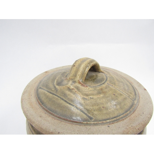 7144 - RICHARD BATTERHAM (1936-2021) A studio pottery lidded pot, greenish glaze and incised line detail. U... 