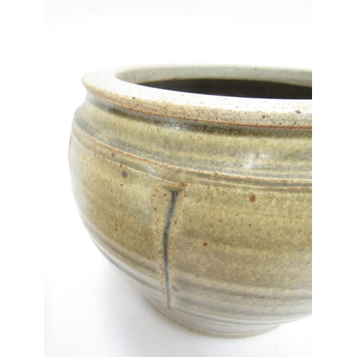 7144 - RICHARD BATTERHAM (1936-2021) A studio pottery lidded pot, greenish glaze and incised line detail. U... 