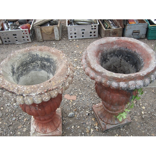 3400 - A pair of composition urns