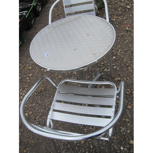 3406 - An aluminium bistro table with two chairs