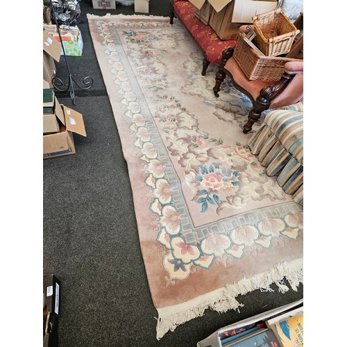 1475 - A Chinese rug with tassel ends, approx. 394cm x 276cm   (R) £25