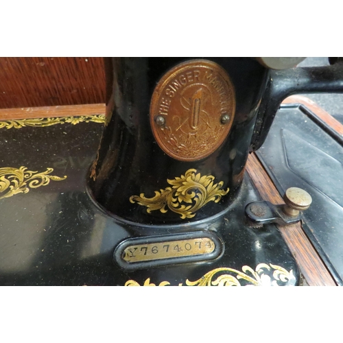 1224 - An oak cased Singer sewing machine