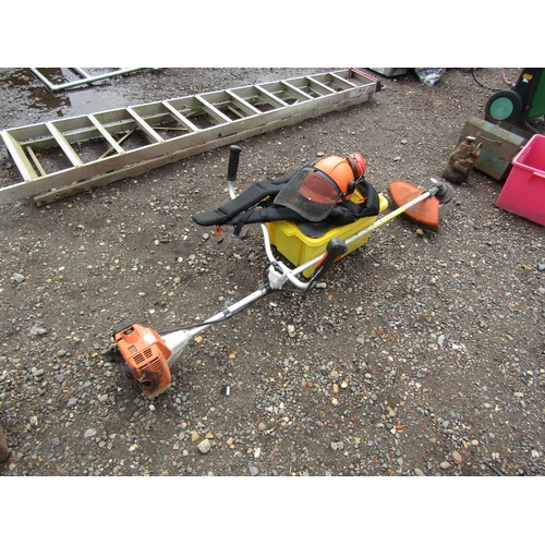 3557 - A Stihl FS85 straight shaft strimmer and accessories