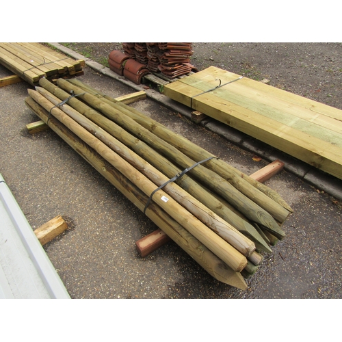 3586 - A quantity of unused 8' round treated posts