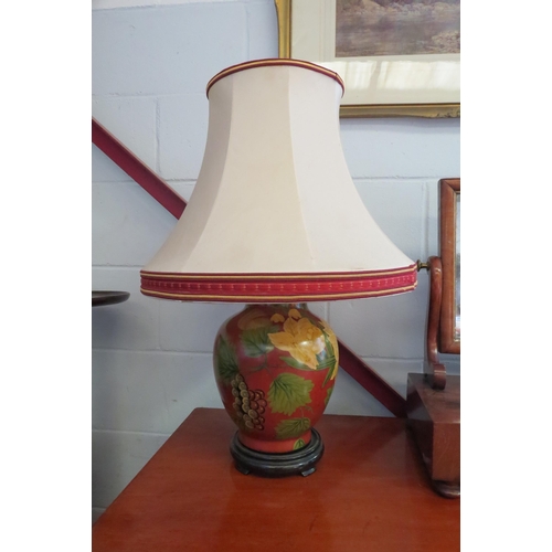 1007 - A floral decorated ceramic table lamp in Eastern style with cream coloured shade    (R) £20