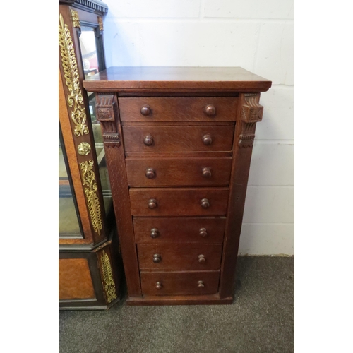 1015 - A late 19th Century oak Wellington chest of seven drawers (large split to side), 98cm tall x 50cm wi... 