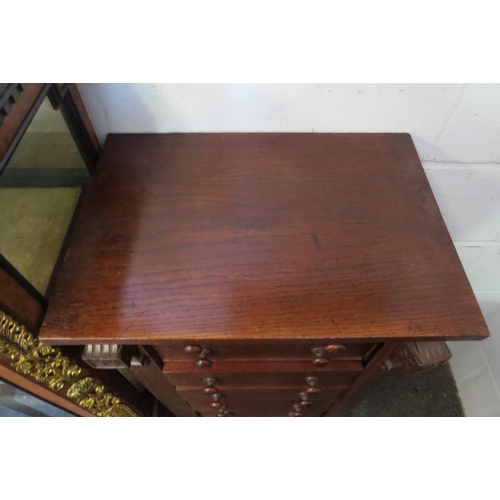 1015 - A late 19th Century oak Wellington chest of seven drawers (large split to side), 98cm tall x 50cm wi... 