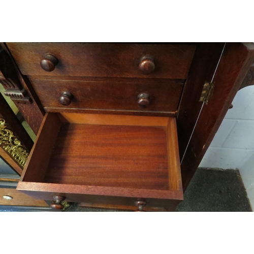 1015 - A late 19th Century oak Wellington chest of seven drawers (large split to side), 98cm tall x 50cm wi... 