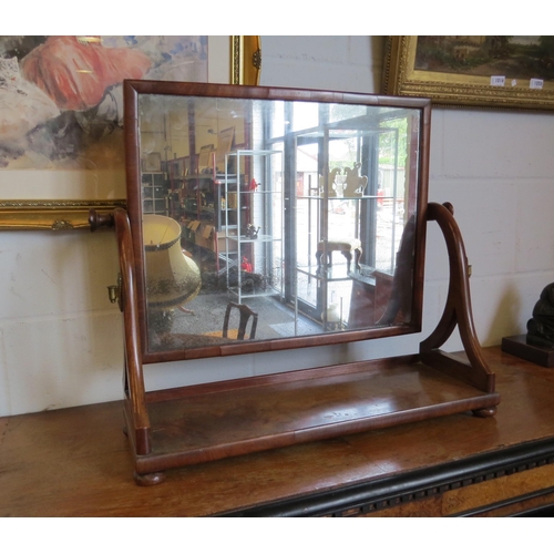 1019 - A mahogany table-top cheval mirror on bun feet