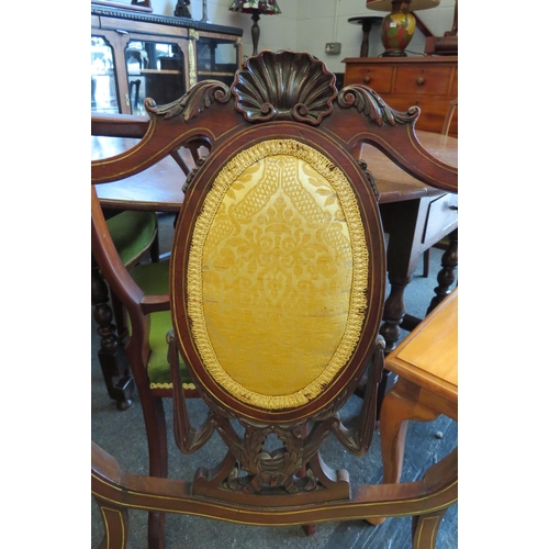 1031 - A Victorian carved mahogany inlaid armchair with oval panel backrest over a serpentine front seat on... 